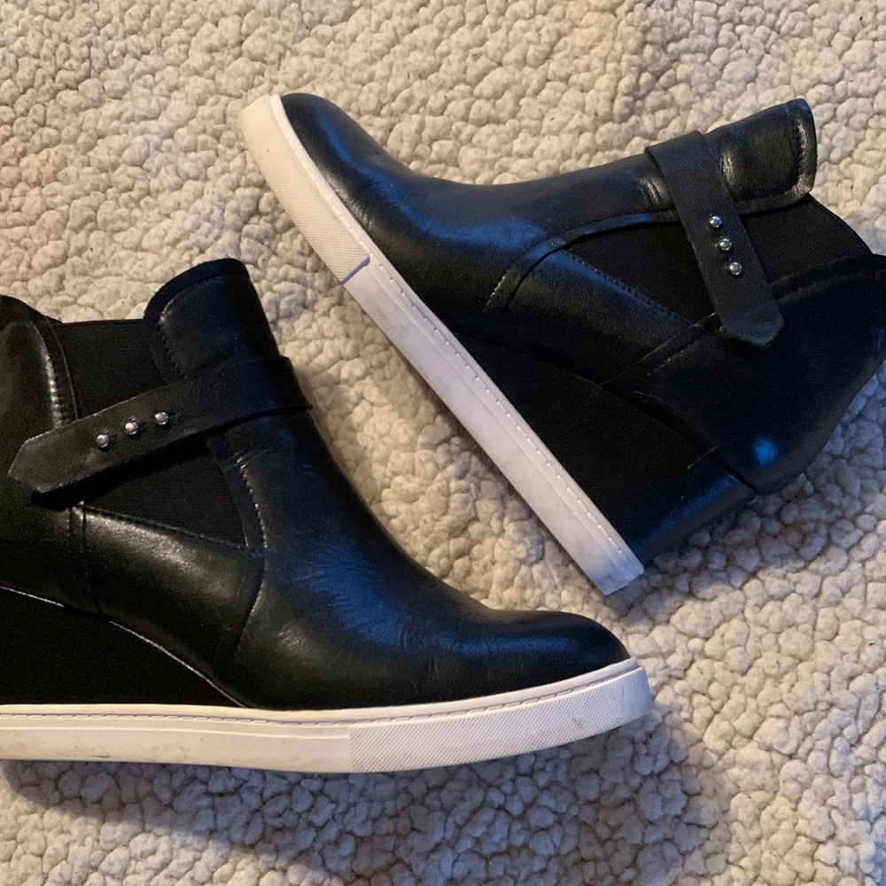 Wedge heeled casual booties with rubber sole.